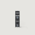 Black and silver cylindrical product on a light gray background