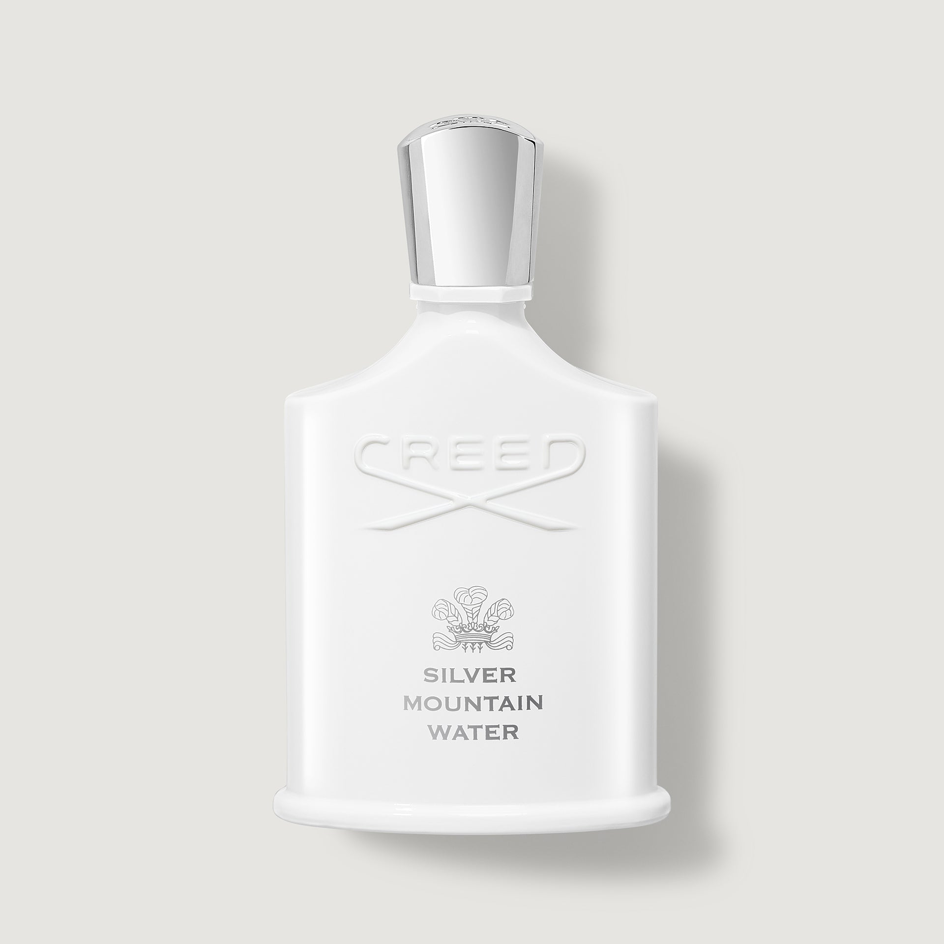White Creed Silver Mountain Water perfume bottle on a light gray background